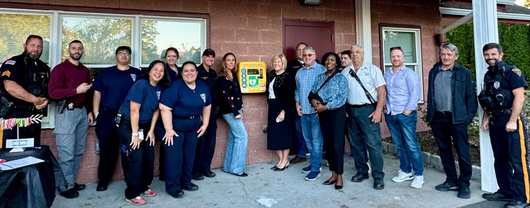 Community members, first responders and foundation representatives gather for the October 2024 outdoor AED dedication at La Grande Park.