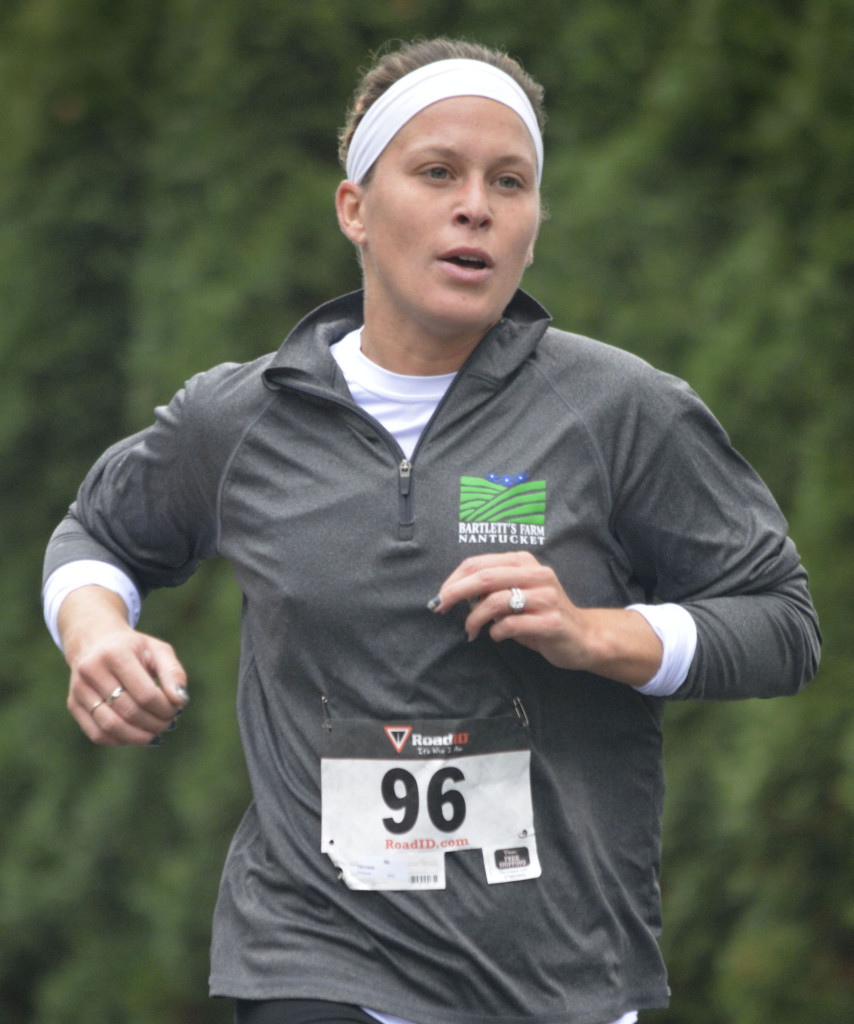 Elizabeth Karnash of Jersey City, N.J., approaches the finish line to win the women's division of the Fanwood 5K in Fanwood, NJ, Sunday, Oct. 25, 2015. Karnash finished the race in 21.5 minutes. (Photo by Brian Horton)