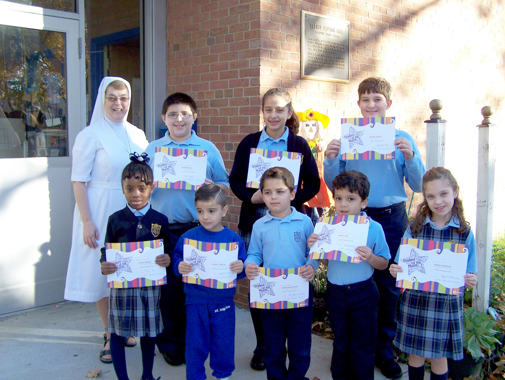 (above l-r) Front Uzoma Ononiwu, Daniel Correia, Joseph Napolitano, Mateo Cruz, Daniella Welker (back,l-r) Back Sr. Helene Godin, Sean Meehan, Gabriela Ronquillo, Michael Grossi