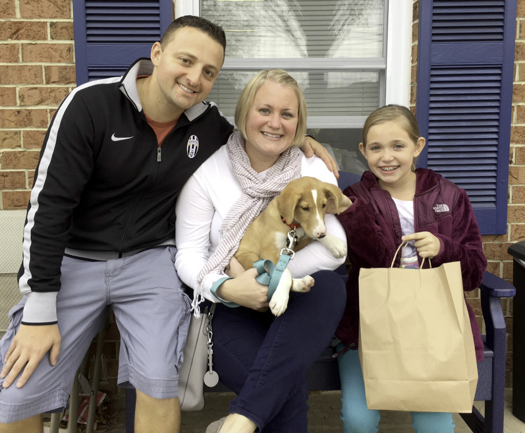 (above) Enrico and Keri Perrone of Madison became the latest benchmark adopters in Home for Good Dog Rescue's five-year history.