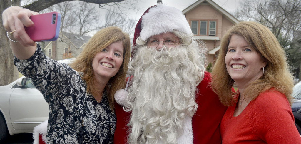 (above) It's not just the kids who want a memento during the Fanwood Fire Department’s "Santa run"