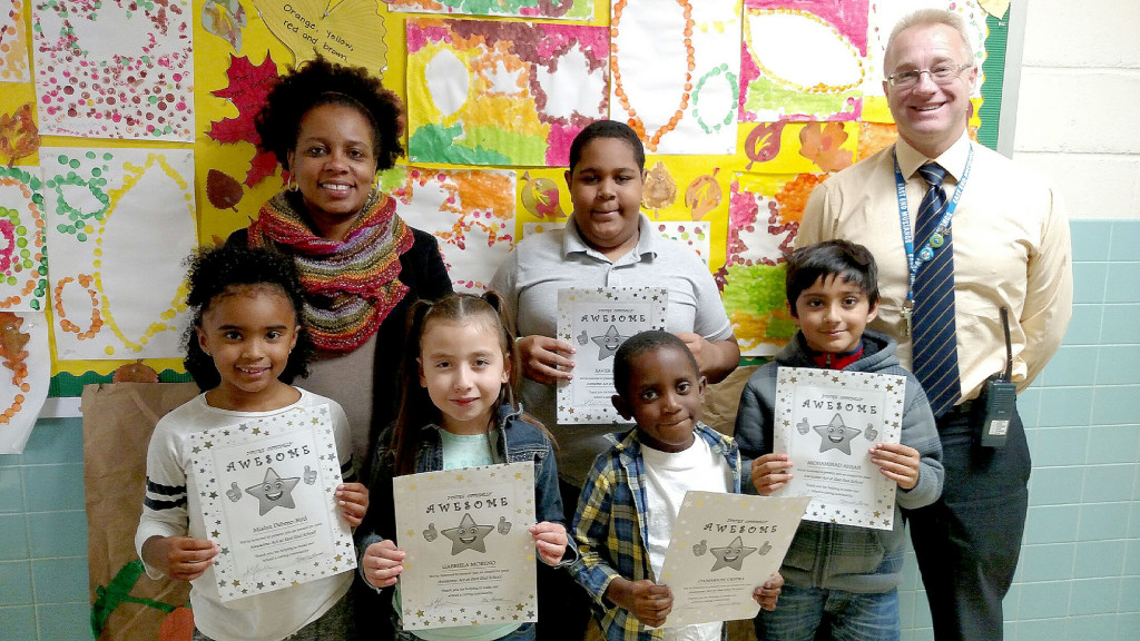 (above, back, l-r) Mia Dabreo-Bird, Gabriela Moreno, Damarian Destra, Mohammad Ahsan (front row, l-r) Mrs. Thomas, Student Liaison, Xavier Sample, Mr. Ferguson, Principal.