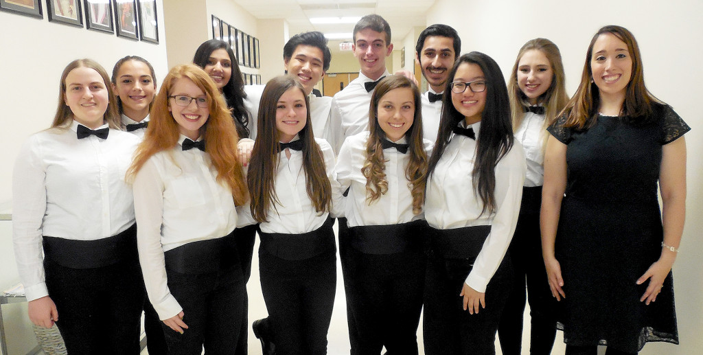 (above) Eleven student singers at Watchung Hills Regional High School have earned appointment to the New Jersey School Music  Association (NJSMA) Central Jersey Regional Chorus. Gathered after participating in the Winter Choral Concert Friday, Dec. 18, at Watchung Hills Regional High School, are Choral Music Teacher Angela DiIorio Bird, front row left, and Central Jersey Regional Chorus members, front row, from left, Kira Leinwand, Angela Celeste, Kyra Anthony, Allison Horvath and Veronica Mu; and back row, from left, Angie Carrano, Anchal Dhir, Eric Bautista, David Kalwicz, Nikhil Bhat, and Hannah Melillo.