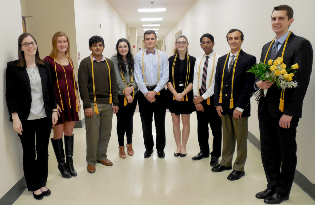 (above) Some 97 seniors inducted into the Watchung Hills Regional High School chapter of the National Honor Society, on Thursday, Dec. 3, in the school’s Performing Arts Center. Among the guests and faculty are, from left, Chemistry Teacher and Faculty Advisor Michelle Madigan; students Community Service Coordinators Sylvia Baeyens of Stirling, Treasurer Ajey Gangwani of Green Brook Township; Vice president Jillian Carbone of Gillette, President Connell Rae of Millington, Secretary Alyssa Rosenblum of Millington, and Tutoring Coordinators Indeevar Beeram of Green Brook Township and Ari Scherzer of Warren Township; and Social Studies Teacher Greg Biniukow, who was selected by the new inductees as their Teacher of the Year.