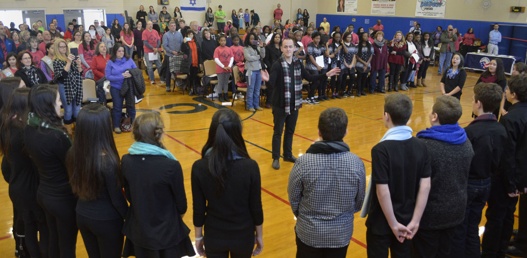 (above) A full house in the gymnasium of the Jewish Community Center listens to the Terrill Middle School choir who sang in honor of Martin Luther King.