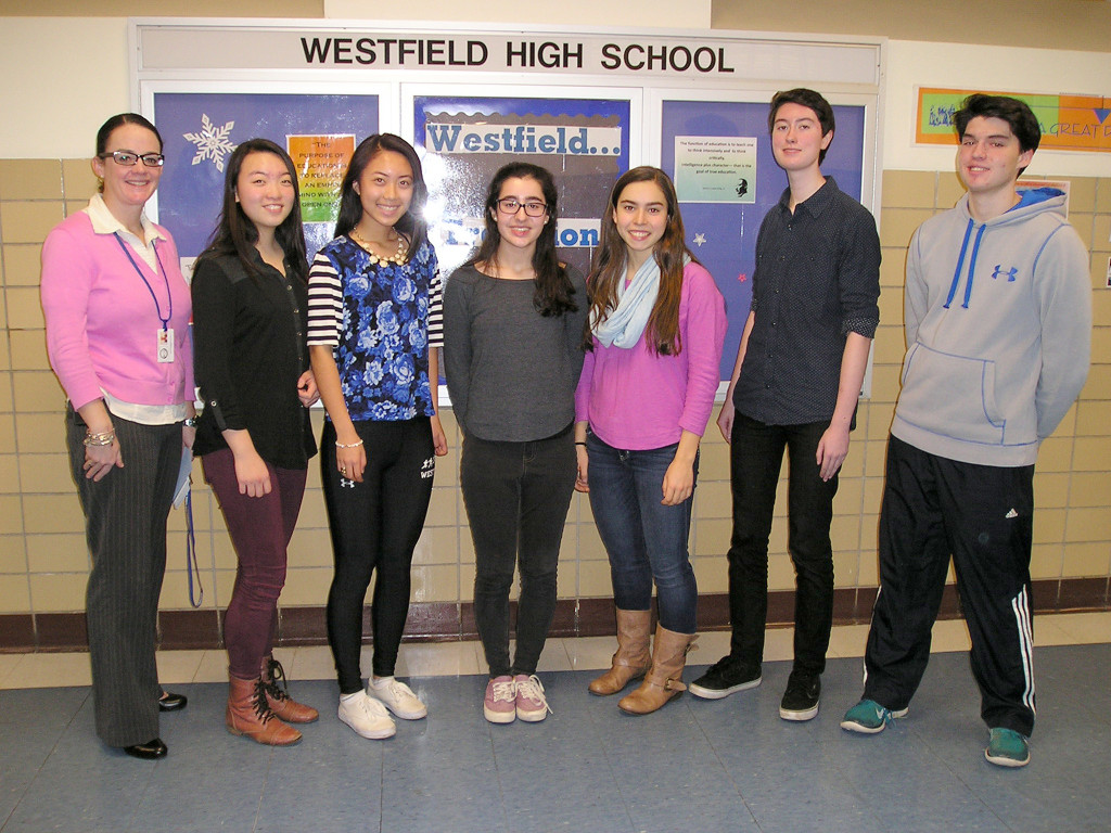 (above) Westfield High School Assistant Principal, Mary Asfendis (far left), expressed her congratulations to these 10th and 11th graders for their top scores (l-r): Sophomores Soo Min Chung and Cindy Qiang – each scoring 800 in Math; and Juniors Emma Cravo – Writing; Charlotte Perez – French w/Listening; Charles Rule – Reading; and Mackail Liderman – Math 2.