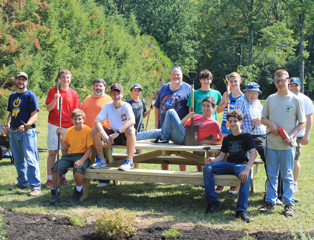 (above) AJ Kornberger and his crew stand around one of the picnic benches constructed for the family picnic area at Roosevelt Park.