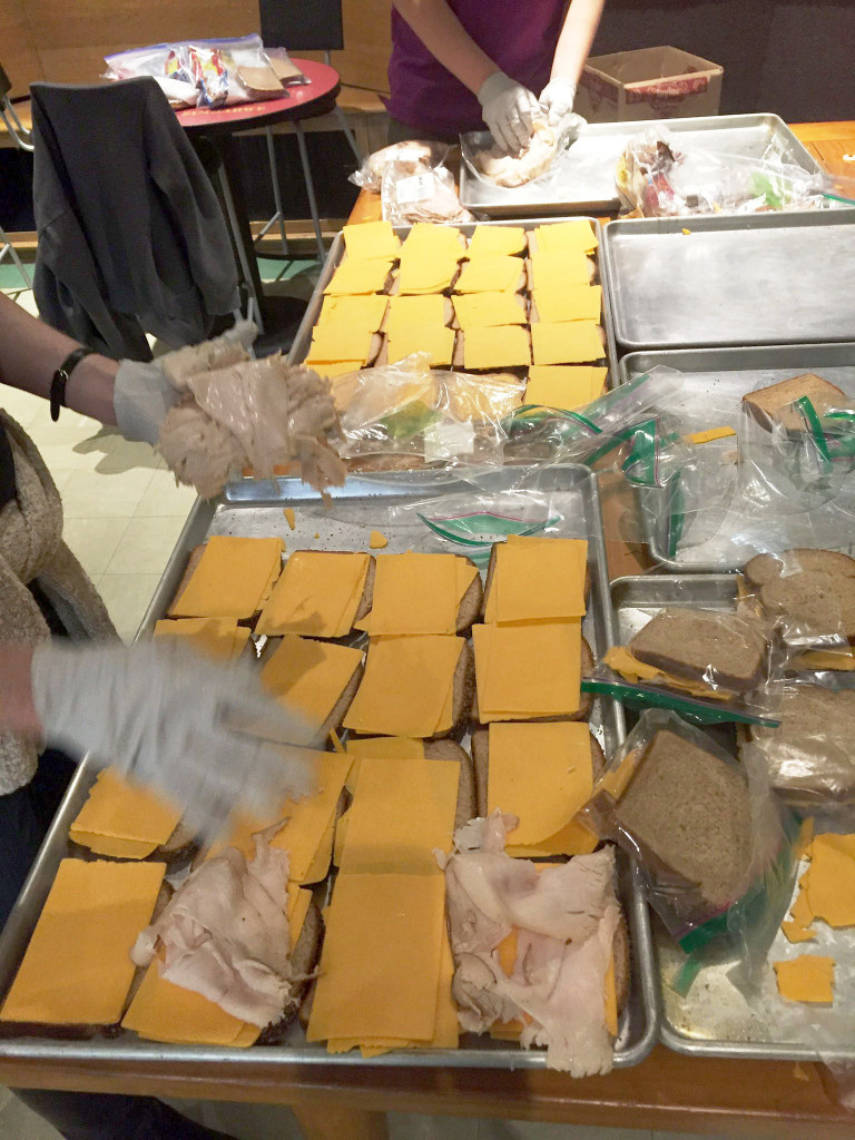 (above) Teens from Central Church in Summit prepare bagged meals for the homeless in NYC prior to Blizzard Jonas.