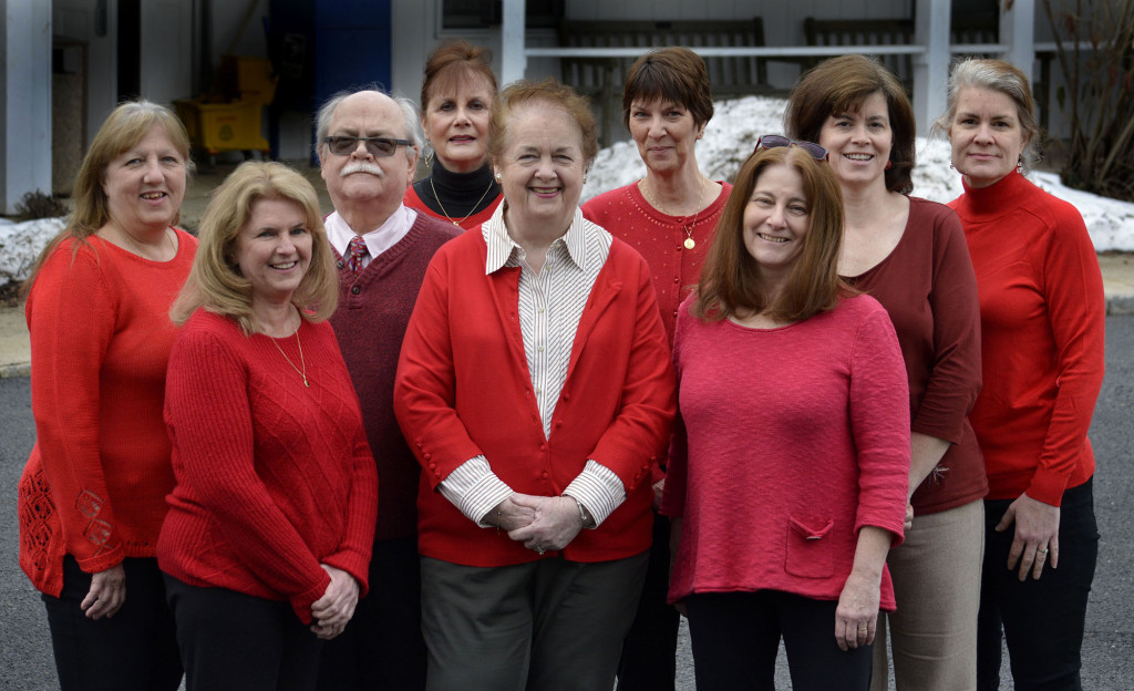 (above l-r) Fanwood Borough Administrator Eleanor McGovern, center in front, and the Borough Hall staff pose in support of the American Heart Association's "Go Red" event. The staff includes, from left, Joy Veeck, Colleen Huehn, Fred Tomkins, Doreen Caccholi, McGovern, Lisa Halloran, Pat Hoynes, Patricia Celardo and Donna Zucker. Photo by Brian Horton