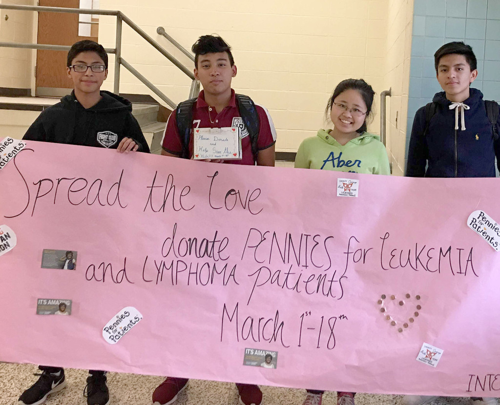 (above) North Plainfield High School Interact Club members display one of the banners that they created to raise awareness for the Pennies for Patients project.