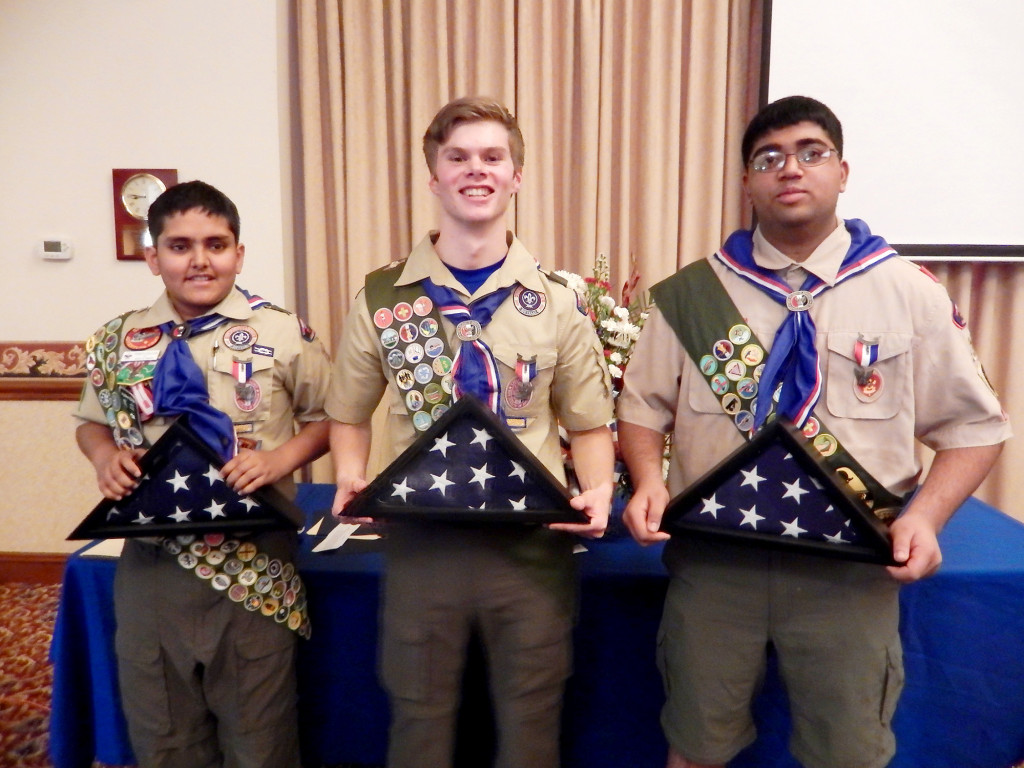 (above l-r) Pramath Kalelkar, Michael Erickson, Ryan Desai holding flags flown over the US Capitol