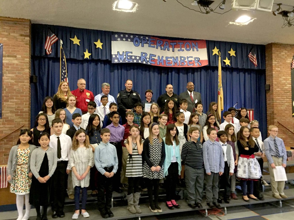 (above, top, l-r) QUEST teacher Andrea Masri and students honor Local Veterans, Sgt. Steve Falk, Lt. Jerry Barter, Sgt. Trent Fettes, Cecile Neri (mother of Crp. Timothy Neri) Sgt. Tom Lombardi, Captain Frank Bolden.