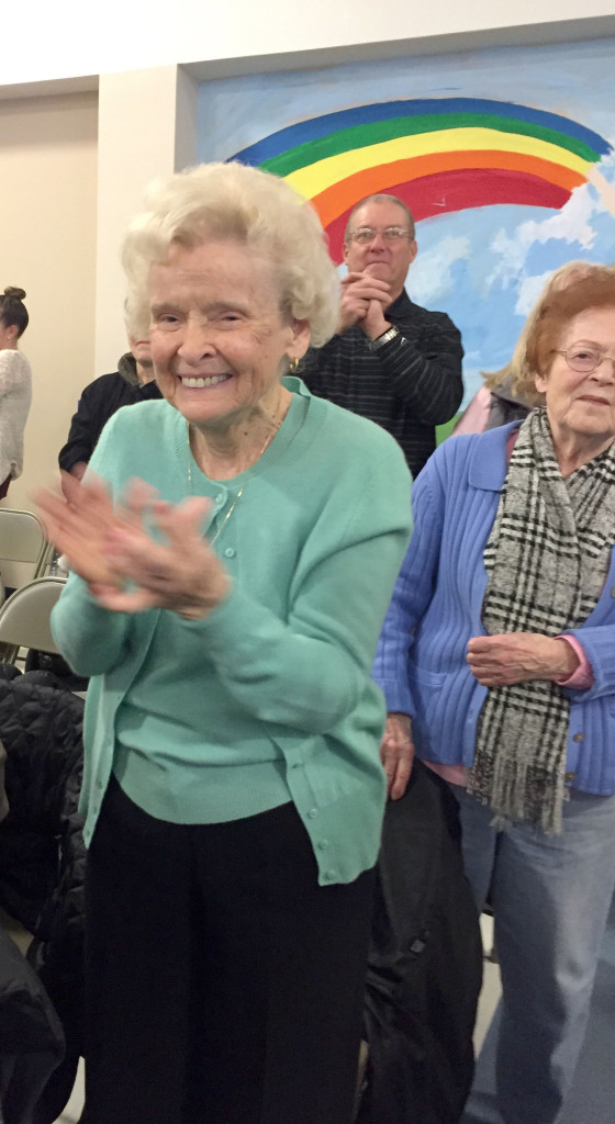 Proud grandparent admires performers