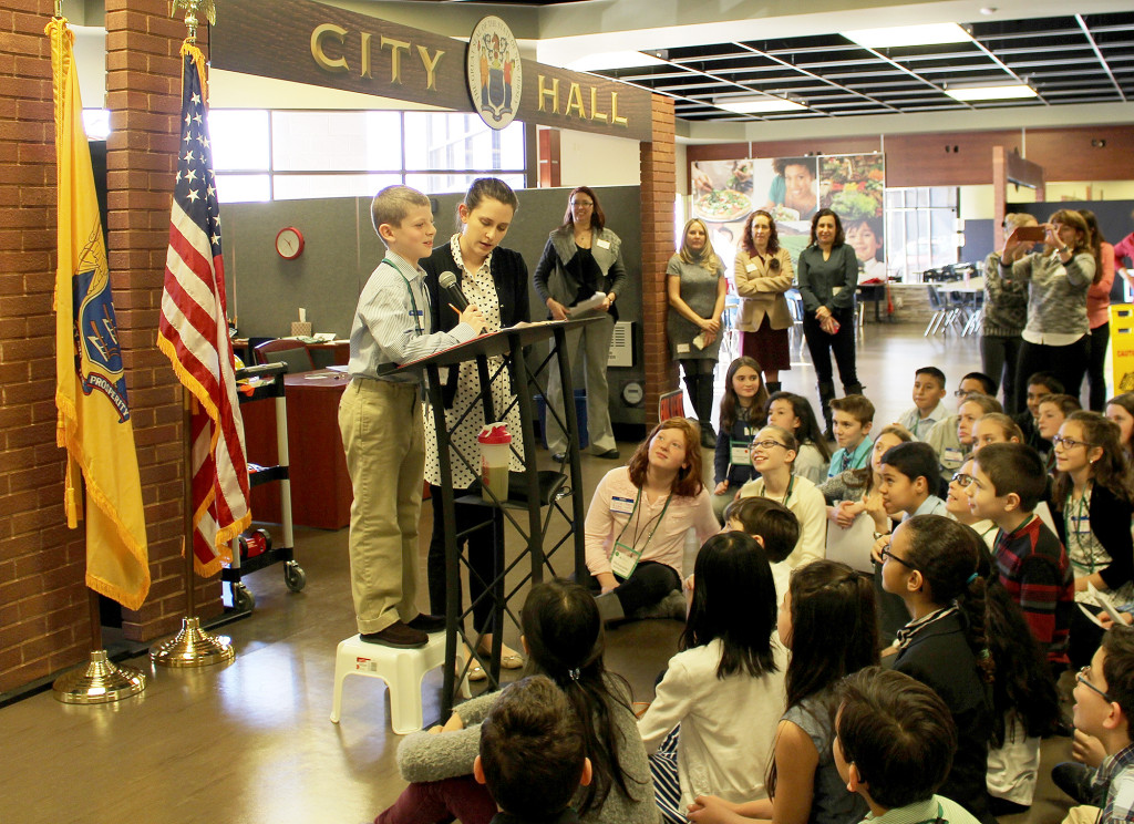 (above) "Mayor" Jonah Segal addresses Central School fifth graders during a visit on Feb. 26 to JA BizTown, a hands-on, simulated business community in Edison offered by Junior Achievement of New Jersey.