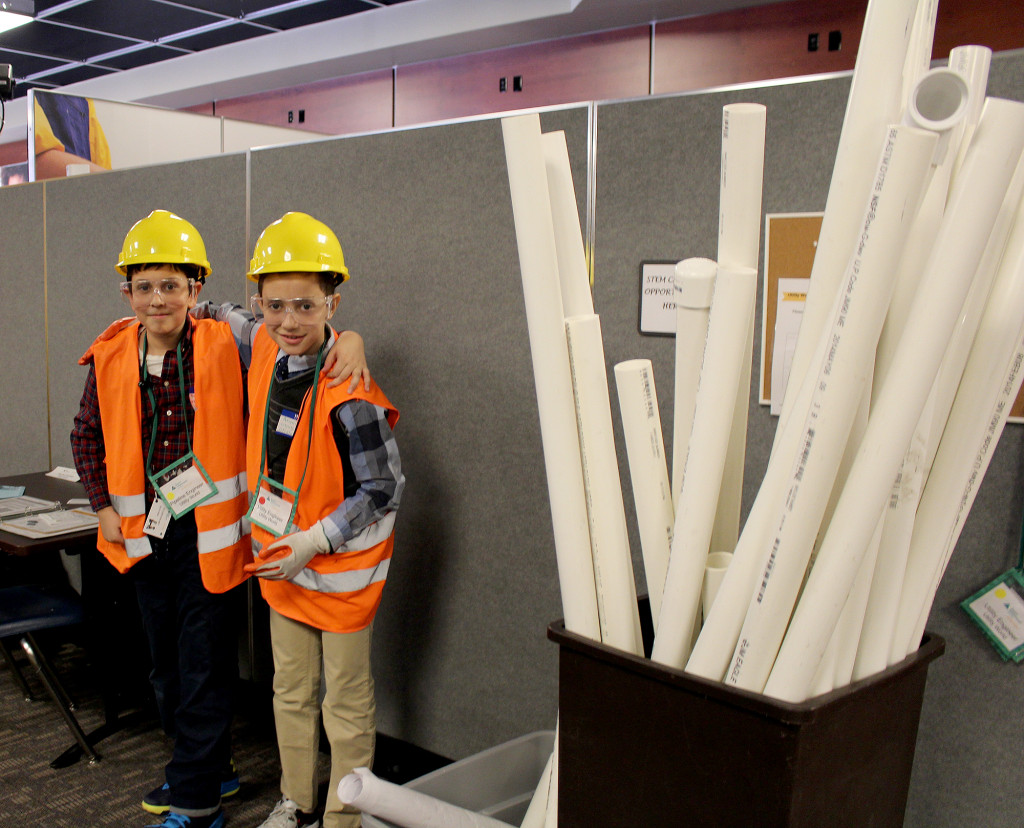 (above) "Pipeline Engineer" Theodoros Pyrsopoulos (L) and "Utility Engineer" Arion Ulaj get ready to lay some pipe.