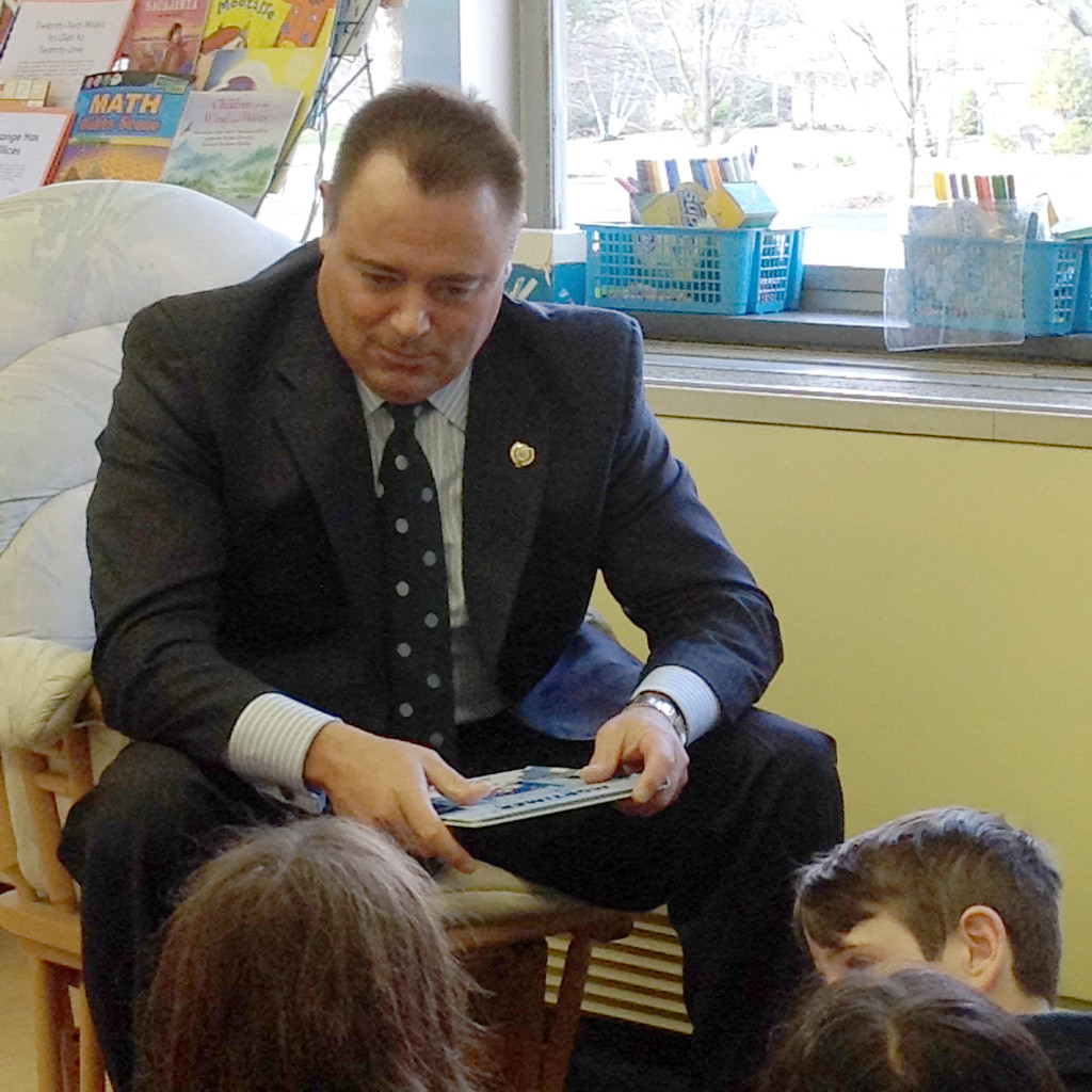 (above) Fanwood Police Chief Trigo reading to a third grade class.