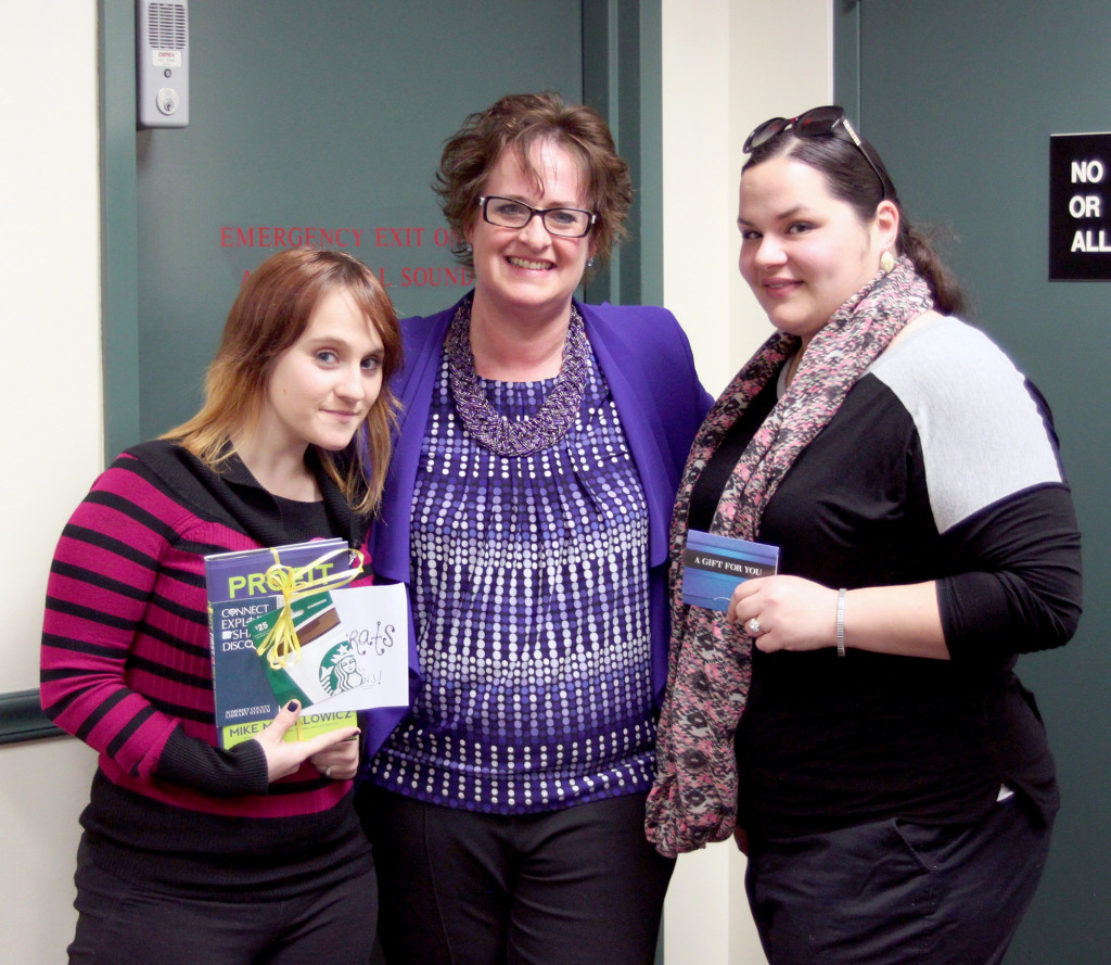 (above) Raffle winners Erika Palmucci and Samantha Jacik show off their prizes alongside Warren Township librarian Catherine DeBerry. Erika (pictured right) won a $25 gift card graciously donated by Provident Bank, and Samantha (pictured left) won a book and $25 dollar Starbucks gift card bundle graciously donated by Infogroup/ReferenceUSA.
