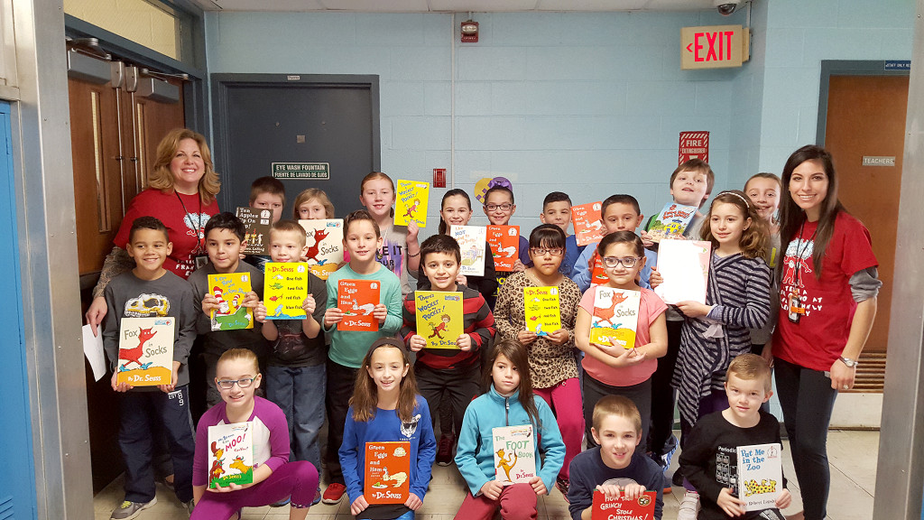 (above, l-r) Mrs. Nina Conner, Mrs. Ann Marie Estevez and their third graders with their chosen Dr. Seuss titles.