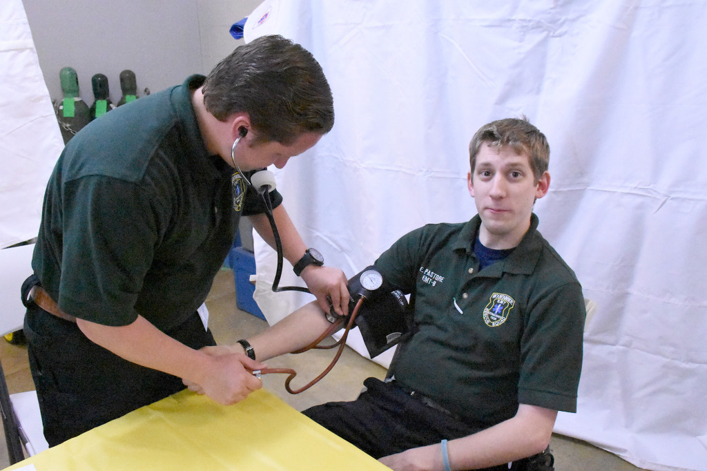 (above) Eric Pastore getting is blood pressure taken.