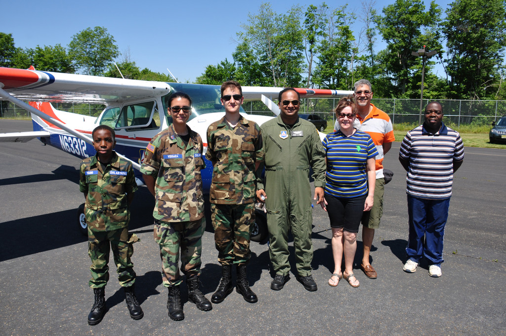 (above l-r) Cadets Young, Vergara, Mena, 1st Lieutenant Adbe, Mrs. Mena, Mr. Mena, andMr. Young.