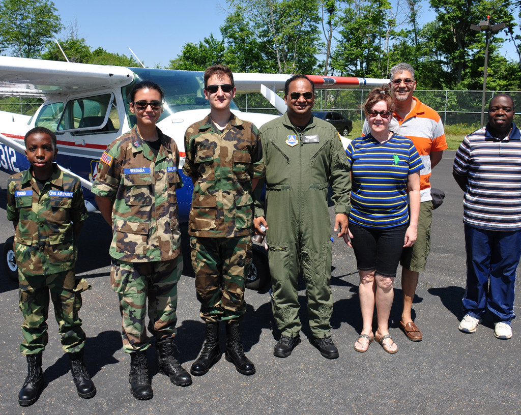 (above l-r) Cadets Young, Vergara, Mena, 1st Lieutenant Adbe, Mrs. Mena, Mr. Mena, andMr. Young.