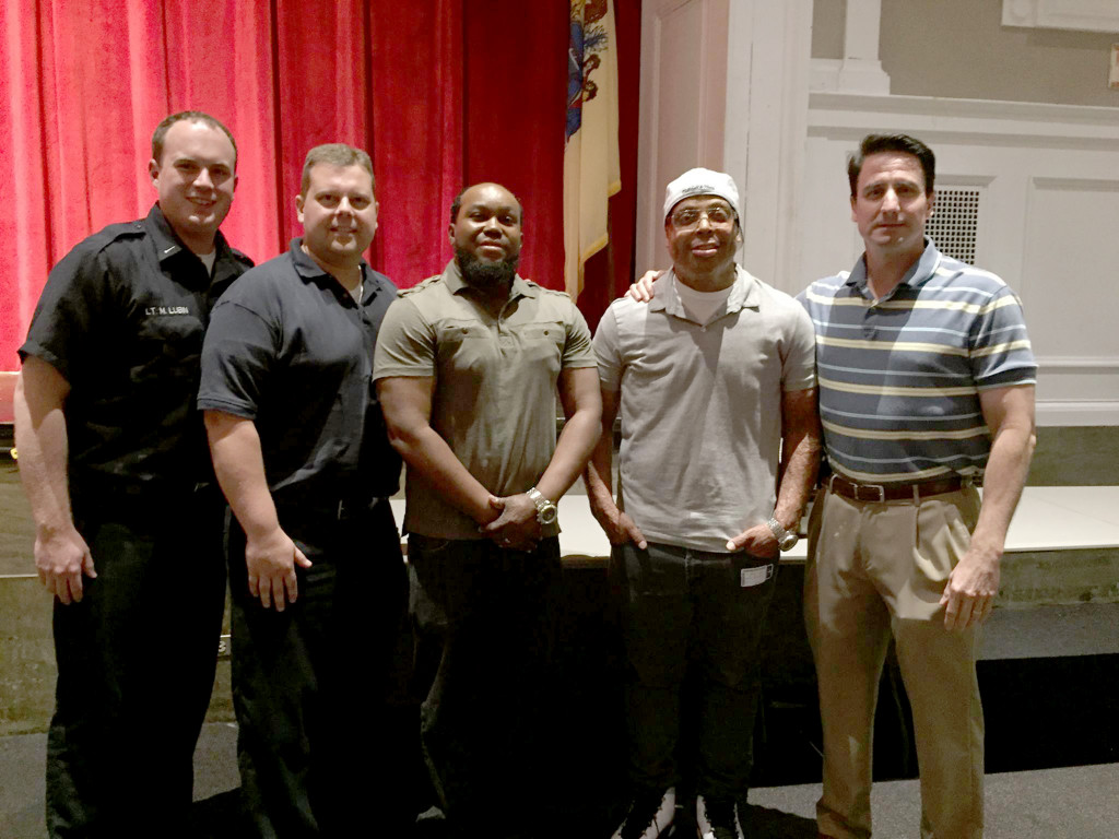 (right) Seton Hall fire survivors Shawn Simons and Alvaro Llanos with Lt. Matthew Lubin, Chief Czeh, and Police Chief Wozniak.