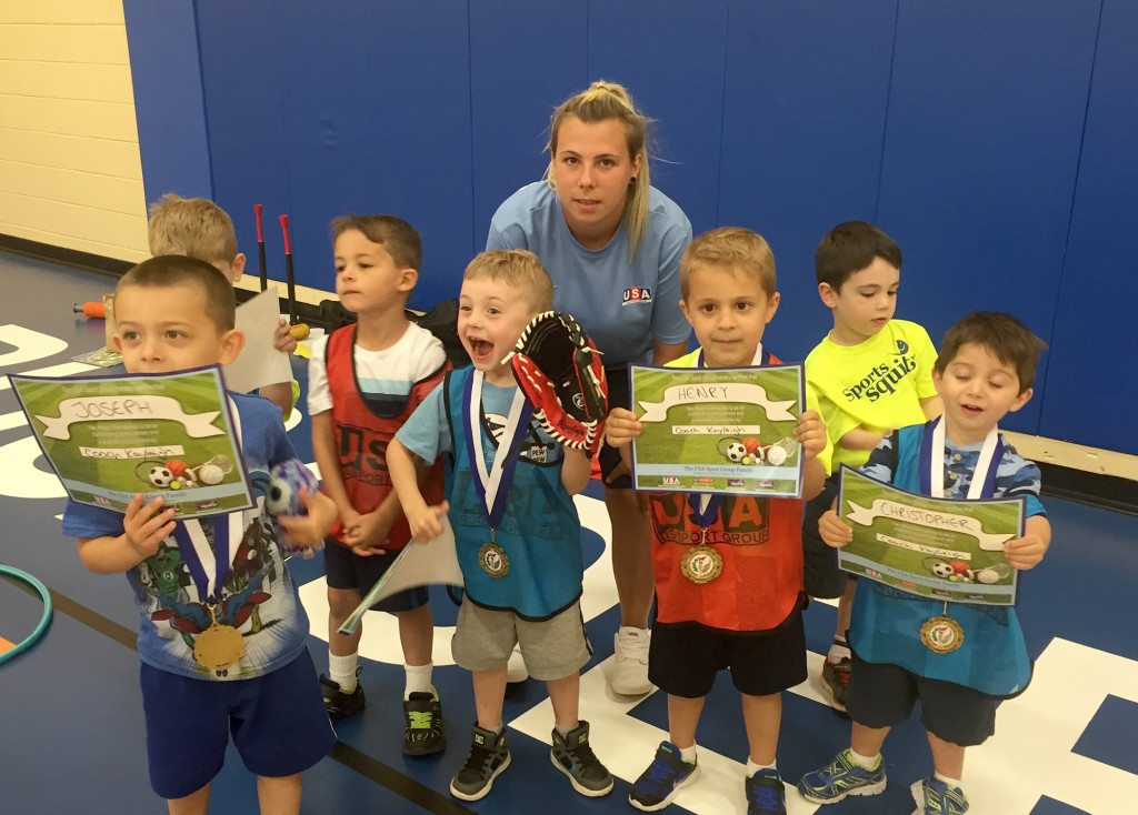 (above) T-Ball Squirt participants proudly show off their completion medals after the medal ceremony recently held at the Clark Recreation Center. The children were coached and taught the basics of the game by USA Sports Institute Coach Cayleigh for 7 weeks.
