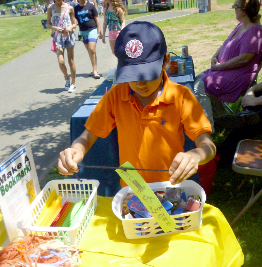 (above) At Watchung Borough's Memorial Day Community Picnic, children visiting Watchung Library's table had a chance to make a bookmark, using rubber stamps, color inks and pencils, and yarn. See what else you can do at the library by visiting www.sclsnj.org.