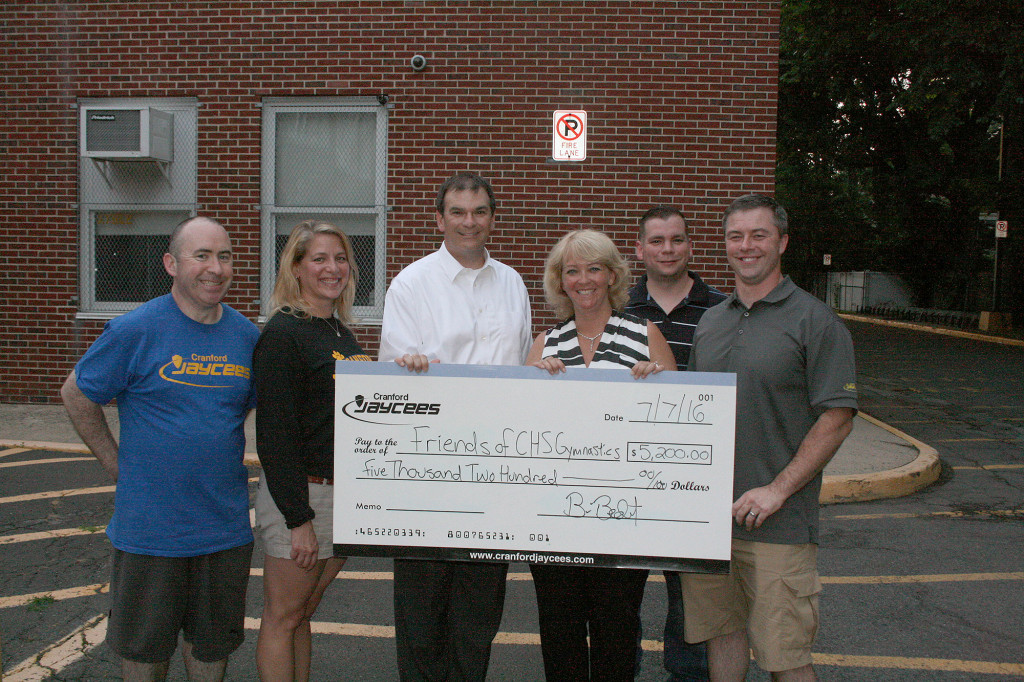 (above l-r) Kevin Cumiskey, Michele Hulse, Brian Bendert, Christine Larrabee, Brian Wing and Sean Gorman in front of the Martin Gymnasium, where the Cranford high school gymnastics team practices and holds their home meets.