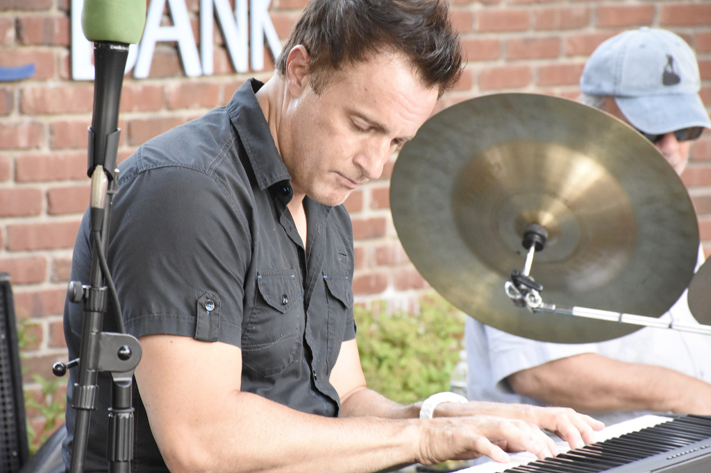 (above) Eric Mintel playing piano. The Eric Mintel Quartet performed on July 5th on East Broad and North Avenue.