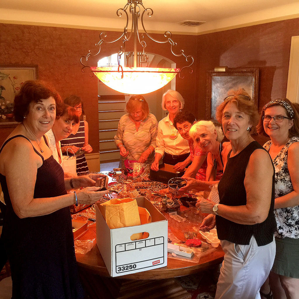(above) Members of the Friends of the Summit Free Public Library sort through jewelry donations at the home of former Mayor Ellen Dickson for their upcoming sale. Sheila Bonnell (far right) and Ellen Dickson are Co-Chairs for the sale.