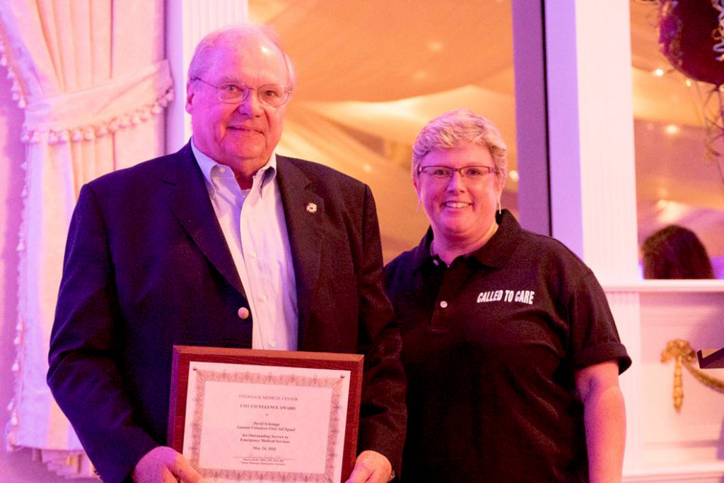 (above) Summit Volunteer First Aid Squad member David Schempp is the city’s winner of this year’s EMT Excellence Award, presented by Overlook Medical Center at a dinner at Berkeley Plaza in Berkeley Heights. Schempp received his plaque from Kari Phair, the squad’s chief.