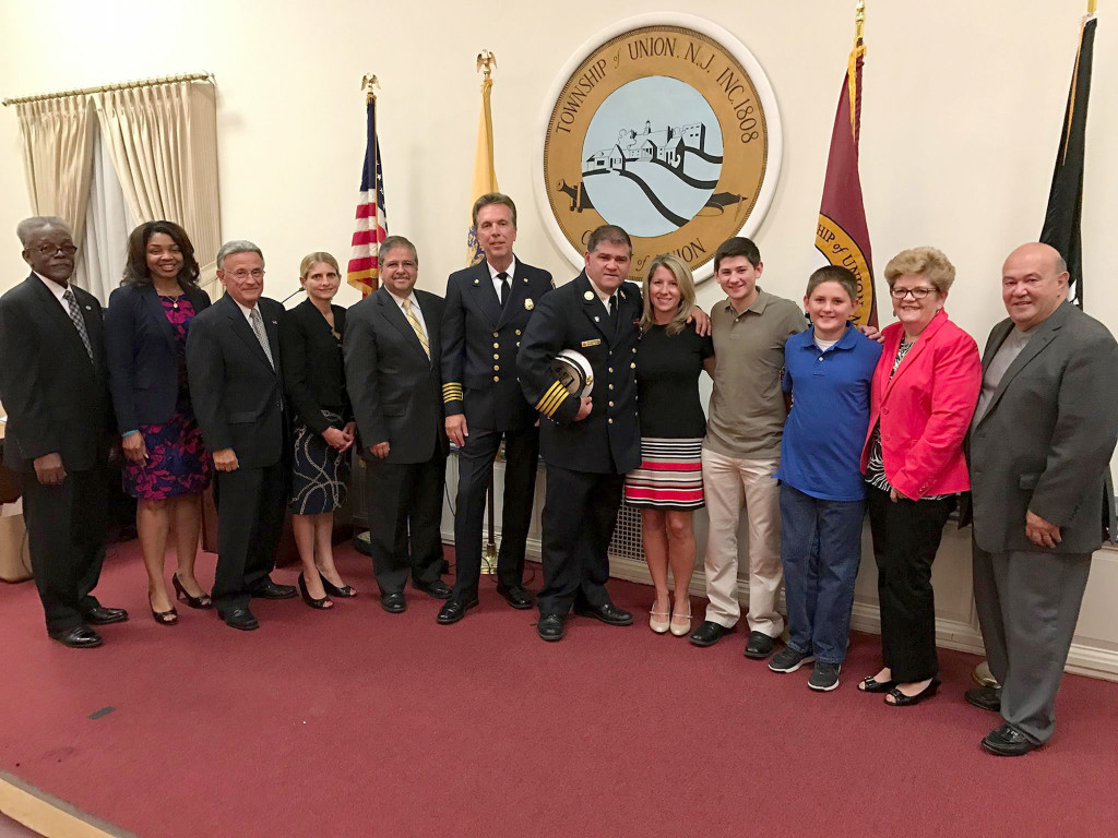 (above Michael Scanio and his family surrounded by the Mayor and members of the Township Committee. Photo courtesy of the Township of Union.