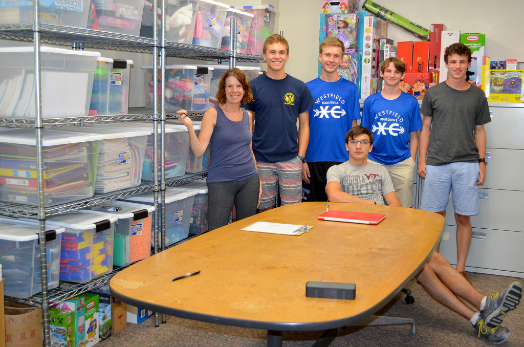 (above) Shown in the completed room are, from left, Mary Claire Givelber, Matt DeBenedetto, Sean Melone, Jonny Givelber and Gabe Givelber; seated, John Sanders.