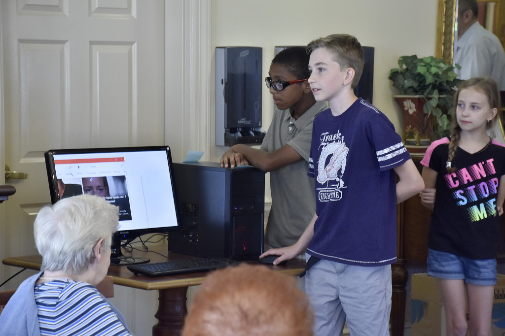 (above) Junaid Ilyas, Kristian Borysiak, Karina Borysiak teaching the computer.