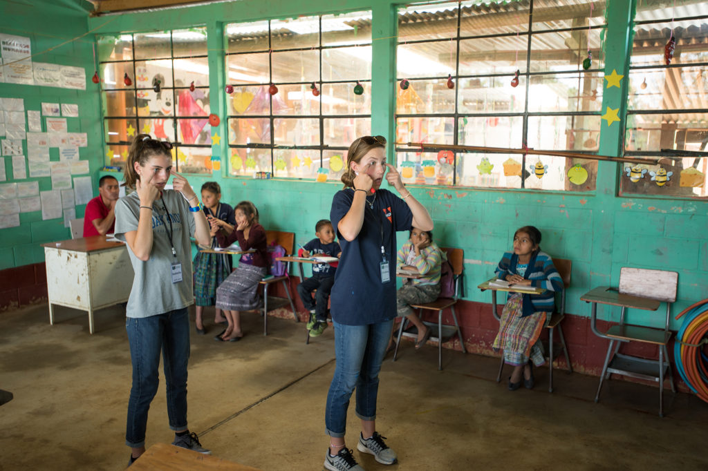 (above l-r) Isabelle Kenny and Christina (Nina) Maurizi, both of Summit, take the reins of the classroom during their service trip to Guatemala this summer. Photo: Adam Richins Photography.