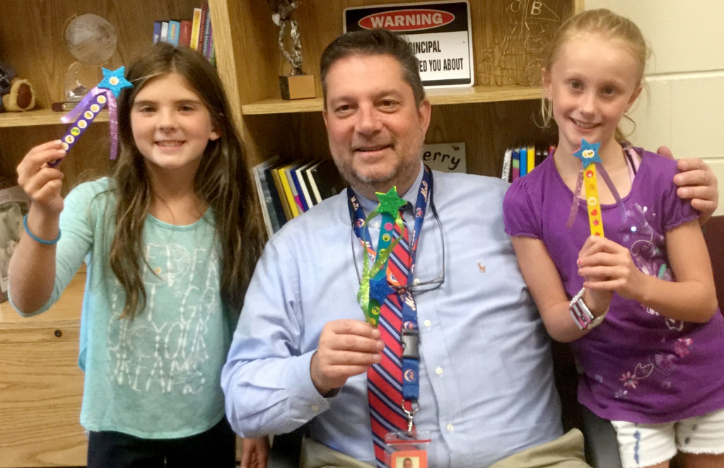(above) Principal of Bayberry School, Michael Vignola, center, with fourth graders Nicole Dahl (left) and Emma Hayes (right) display their magic wands as part of the kick off to the fourth grade kindness project. The fourth grade is busy making magic wands to bring "The Magic of Kindness" to all the students and staff of Bayberry School. This was one of the schoolwide activities for the National Week of Respect, October 3rd - 7th.
