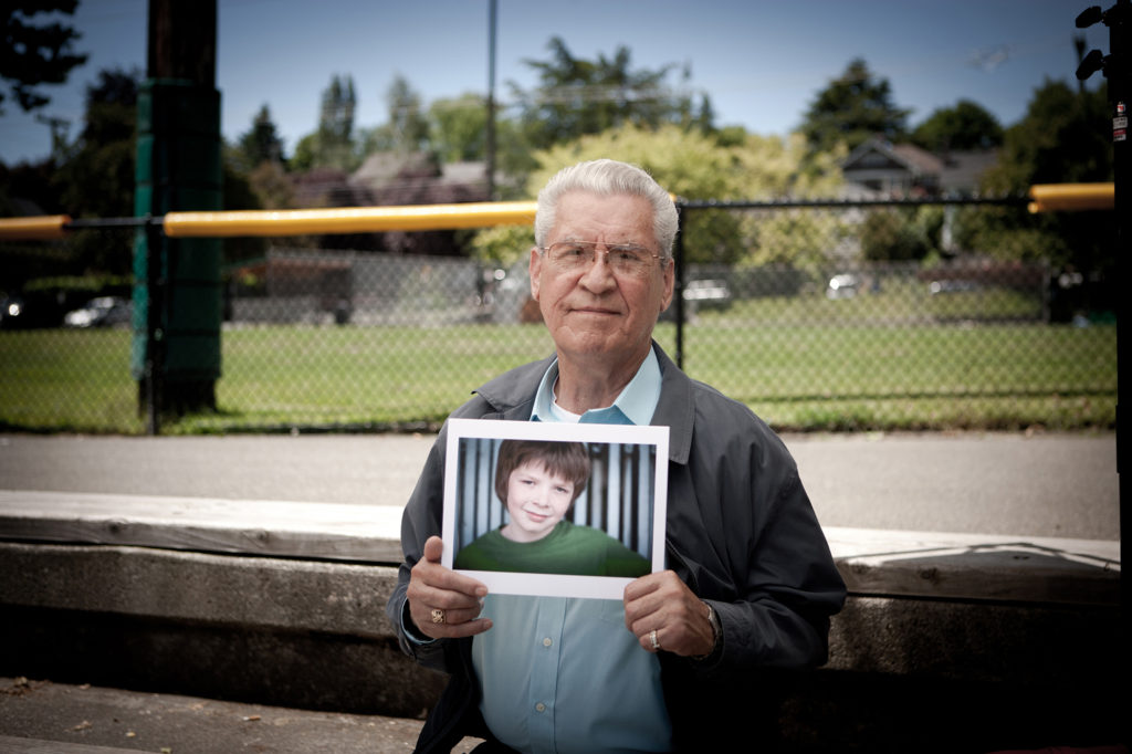 man-holding-pic-of-boy