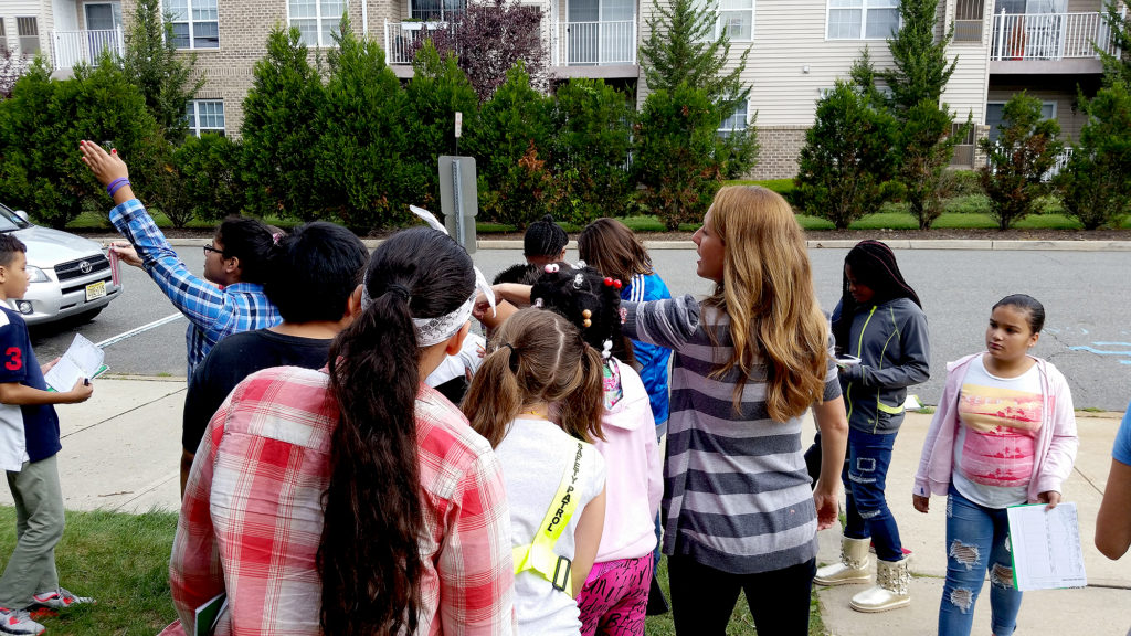 (above) Mrs. Nicole Brighouse and her students outside using the various weather tools and collecting their data.