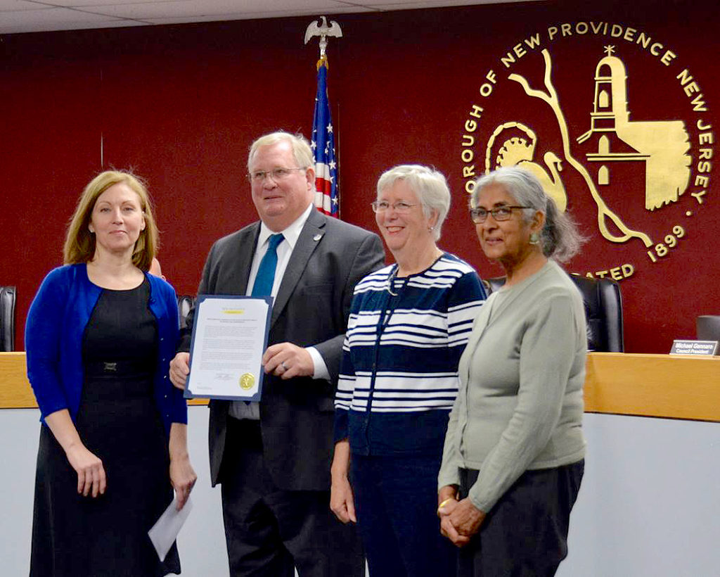 (above l-r) Mayor Allen Morgan, SAGE Eldercare Executive Director Angela Sullivan, Board of Trustees President Kitty Hartman, a resident of New Providence, and Trustee Geetha Ghai.