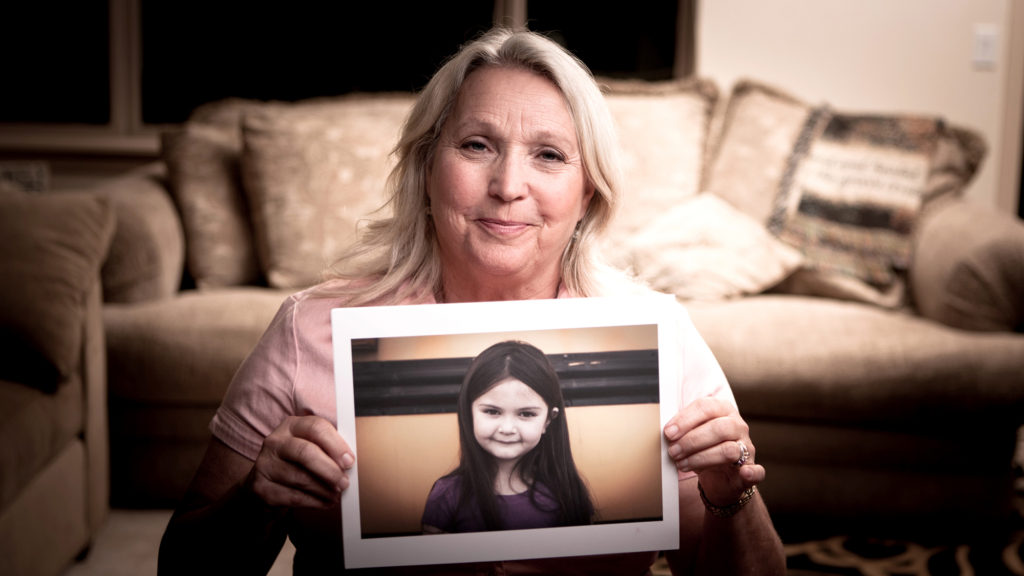 woman-holding-pic-of-girl