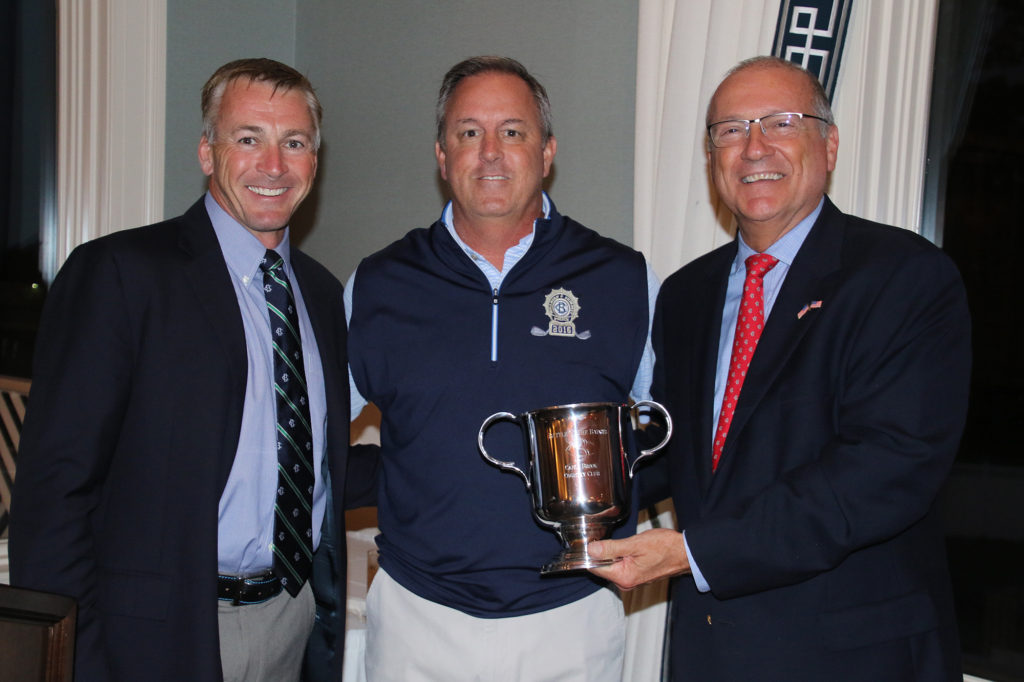 (above) Chief Weck accepts the Battle of the Badges Cup in victory from Canoe Brook's George Deitz and Albert Constantini.